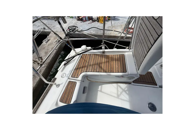 Slide: The Image of Cockpit of 2009 Beneteau Oceanis 40 with teak flooring and stainless steel railings. - 77