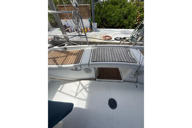 Slide: The Image of Beneteau Oceanis 40 sailboat deck, 2009 model, featuring teak wood panels and nautical equipment. - 78