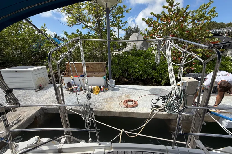 Slide: The Image of Dockside view from a 2009 Beneteau Oceanis 40 sailboat, with maintenance supplies visible. - 81