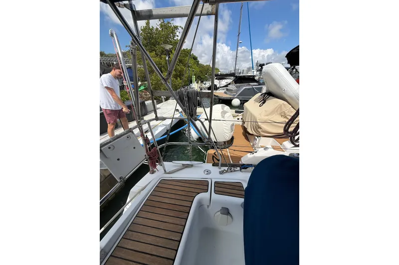Slide: The Image of Beneteau Oceanis 40 sailboat docked, 2009 model, with a person on the pier. - 82