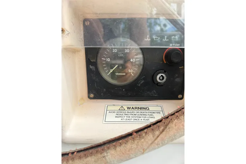 Slide: The Image of Control panel of a 2009 Beneteau Oceanis 40 sailboat with warning label. - 87