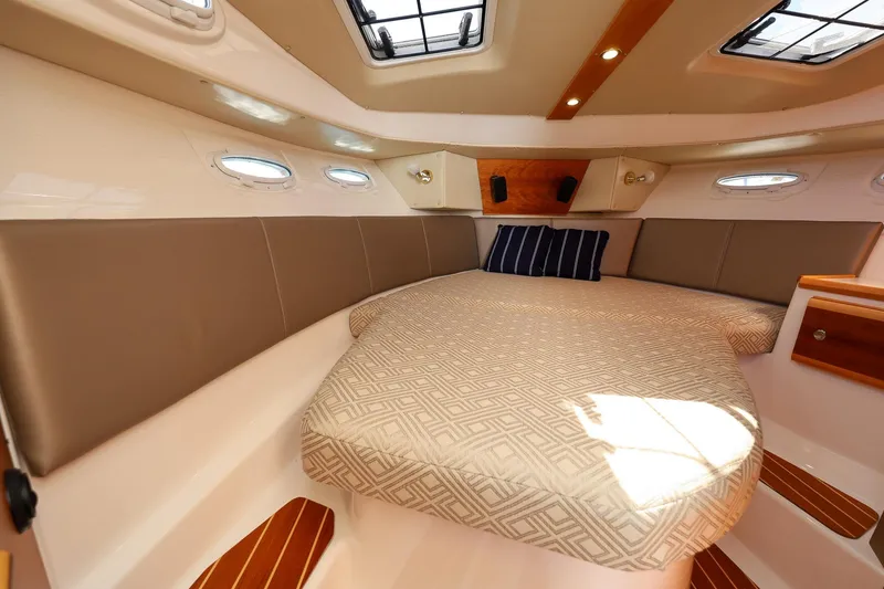 Slide: The Image of Luxurious interior cabin of 2019 Cutwater C-302 Coupe with cozy bed and elegant design. - 25
