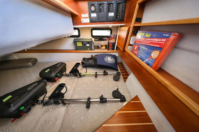Slide: The Image of 2019 Cutwater C-302 Coupe cabin storage with marine equipment and signal kit. - 29