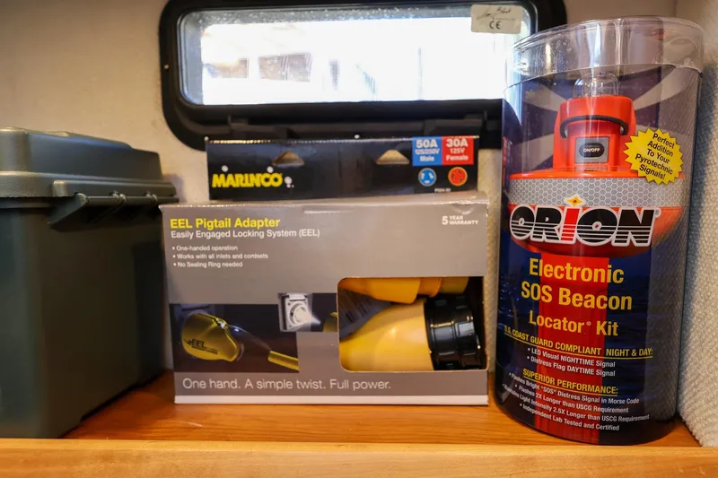 Slide: The Image of Marine safety equipment and adapter in a 2019 Cutwater C-302 Coupe cabin. - 32