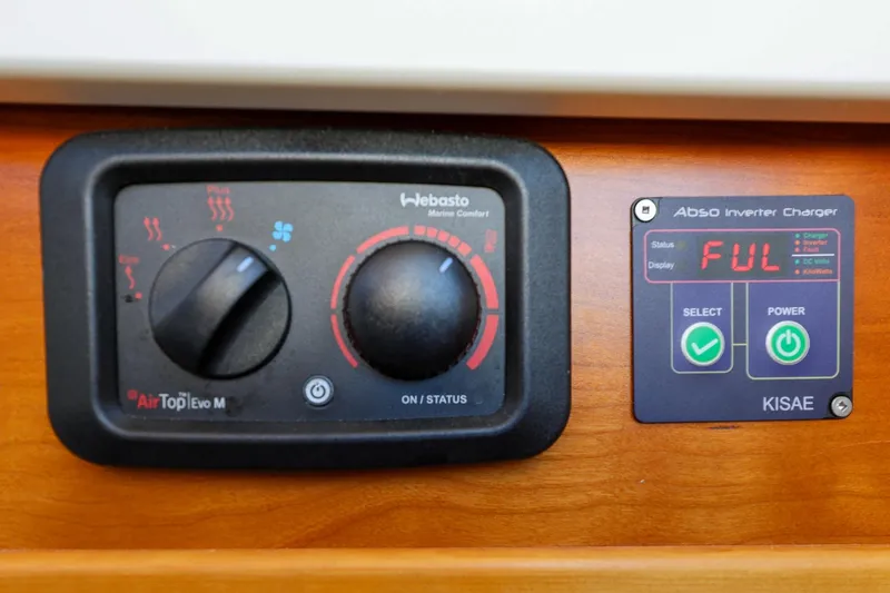 Slide: The Image of Control panel of a 2019 Cutwater C-302 Coupe featuring Webasto heater and Kisae inverter charger. - 33