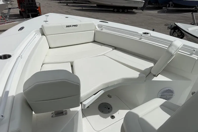 Slide: The Image of 2026 Sea Pro 265FLX Sandbar boat interior with white cushioned seating. - 12