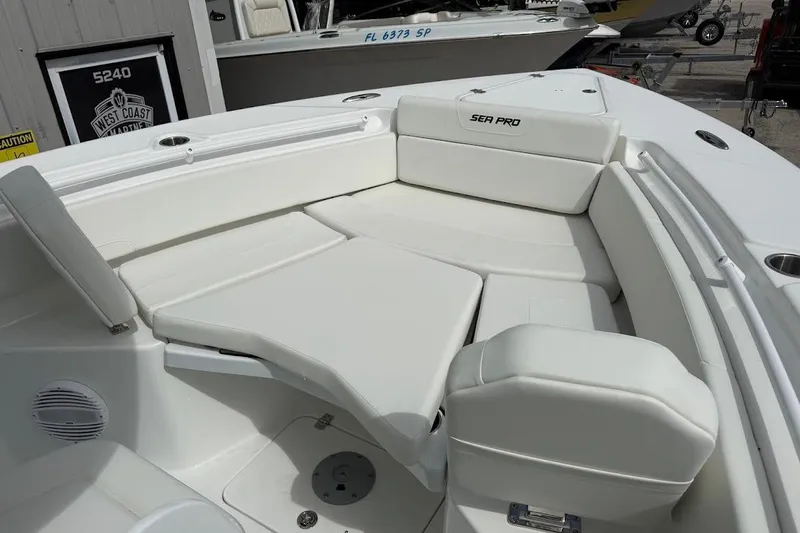Slide: The Image of 2026 Sea Pro 265FLX Sandbar boat with spacious white seating area. - 18