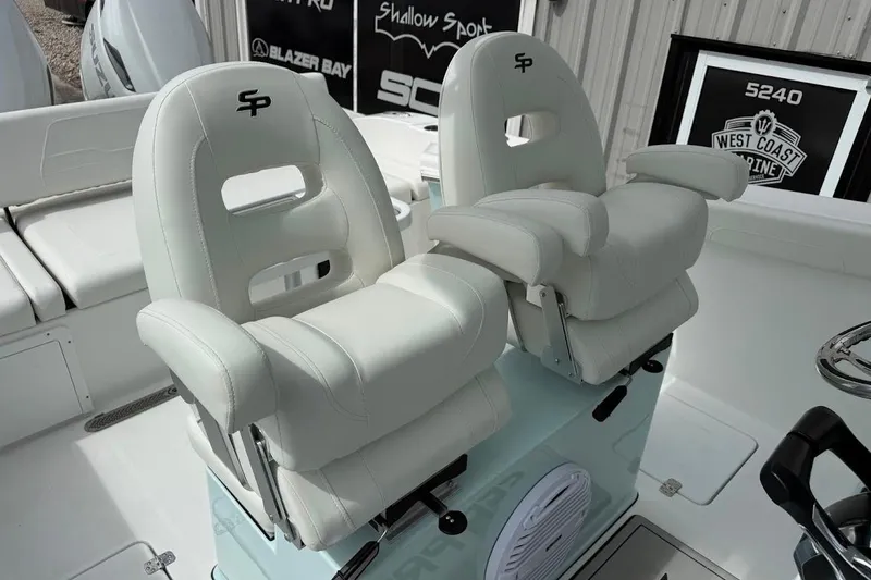 Slide: The Image of 2026 Sea Pro 265FLX Sandbar boat with luxurious white seating and modern design. - 19