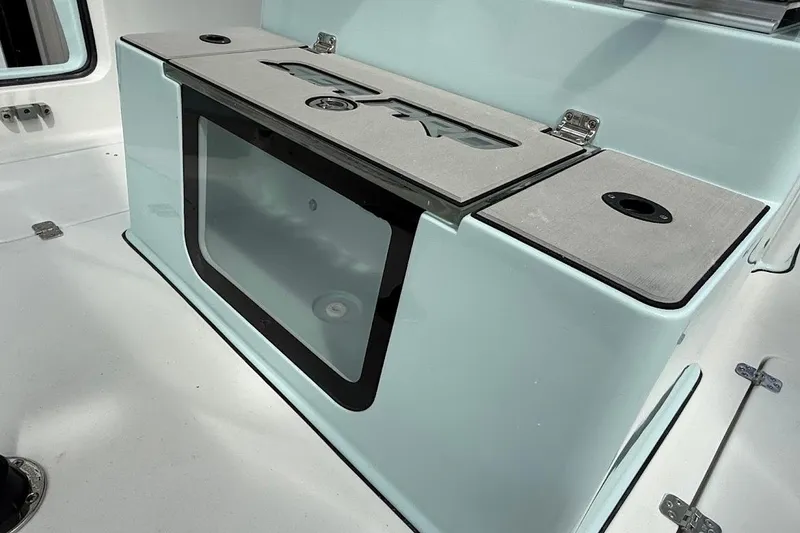 Slide: The Image of 2026 Sea Pro 265FLX Sandbar boat interior with storage compartment and sleek design. - 29