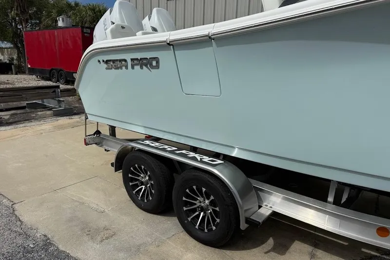 Slide: The Image of 2026 Sea Pro 265FLX Sandbar boat on trailer, showcasing sleek design and branding. - 3