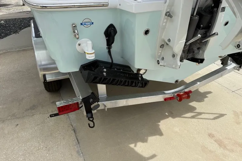 Slide: The Image of 2026 Sea Pro 265FLX Sandbar boat on trailer, rear view showing motor and hull details. - 6