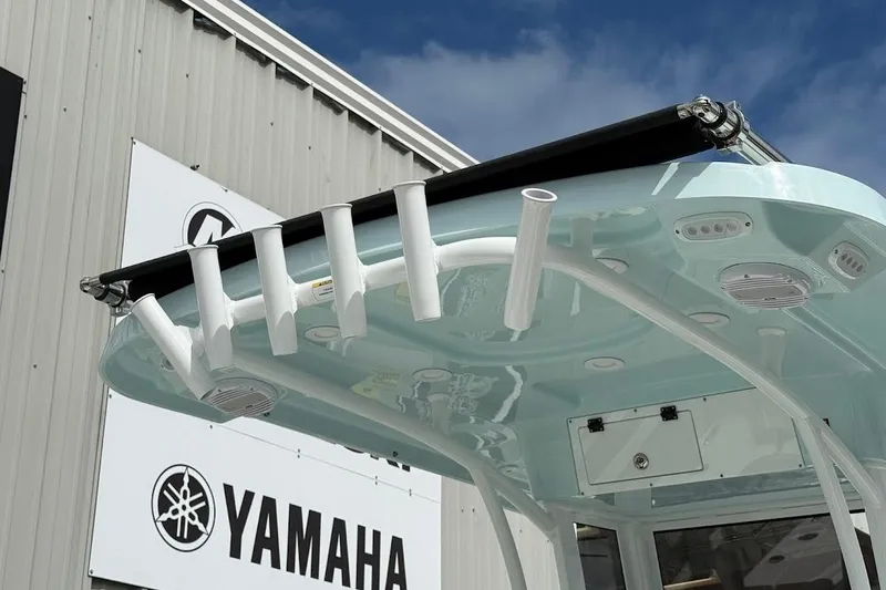 Slide: The Image of 2026 Sea Pro 265FLX Sandbar boat with rod holders, near Yamaha building. - 7