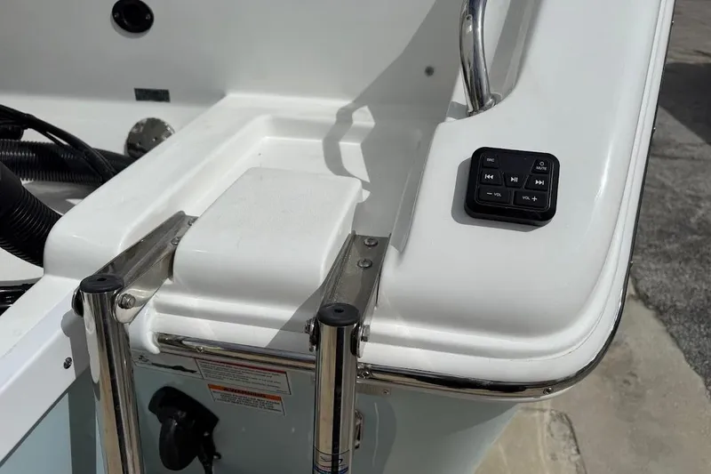 Slide: The Image of 2026 Sea Pro 265FLX Sandbar boat ladder and control panel detail. - 9