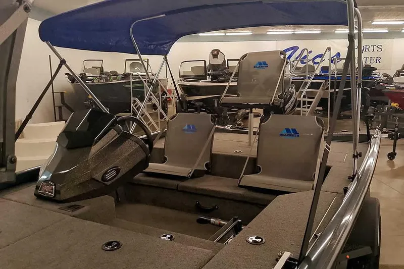 Slide: The Image of 2021 Ranger RT178 boat with canopy and seating in showroom. - 11