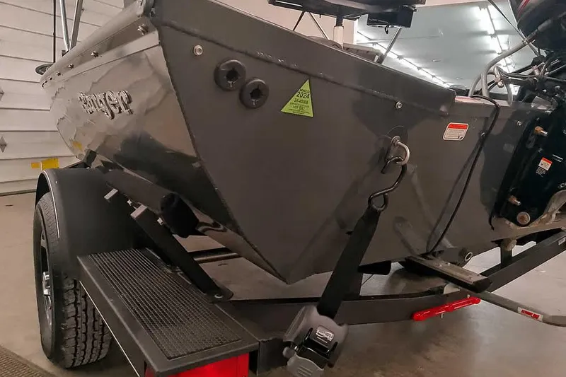Slide: The Image of 2021 Ranger RT178 boat on trailer in indoor garage setting. - 13