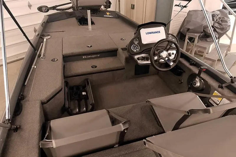 Slide: The Image of 2021 Ranger RT178 boat interior with steering wheel and Lowrance electronics. - 15