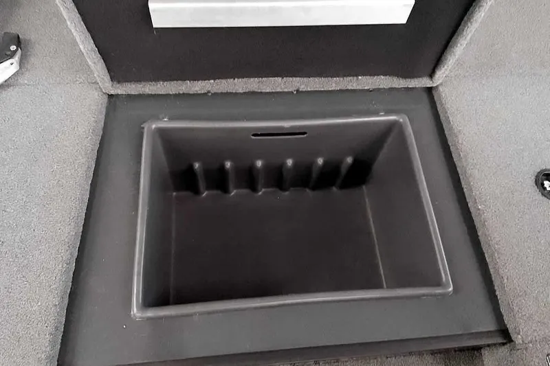Slide: The Image of 2021 Ranger RT178 boat storage compartment, open and empty, with carpeted surroundings. - 17