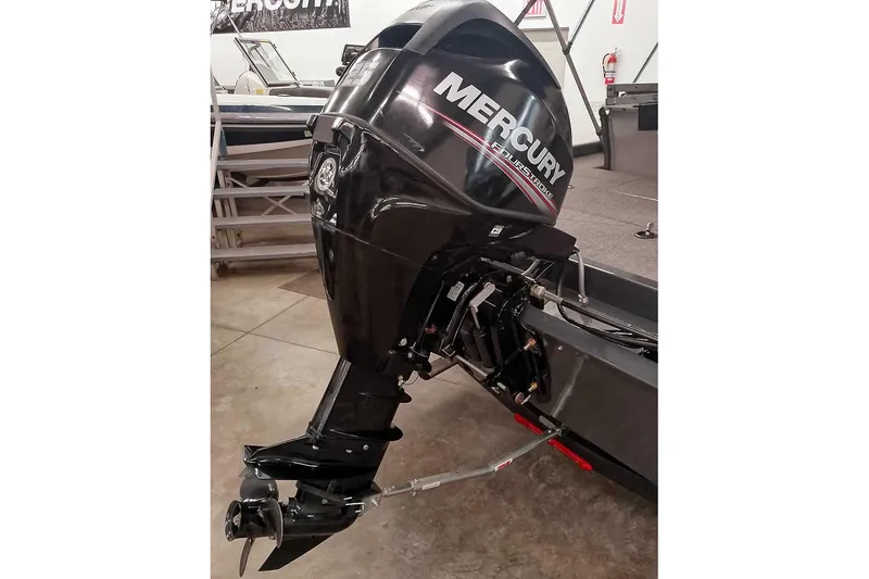 Slide: The Image of 2021 Ranger RT178 boat with Mercury outboard motor in showroom. - 2