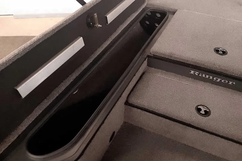 Slide: The Image of 2021 Ranger RT178 boat interior storage compartment with carpeted finish and secure latches. - 22