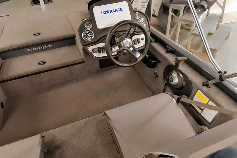 Slide: The Image of 2021 Ranger RT178 boat cockpit with steering wheel and Lowrance display. - 26
