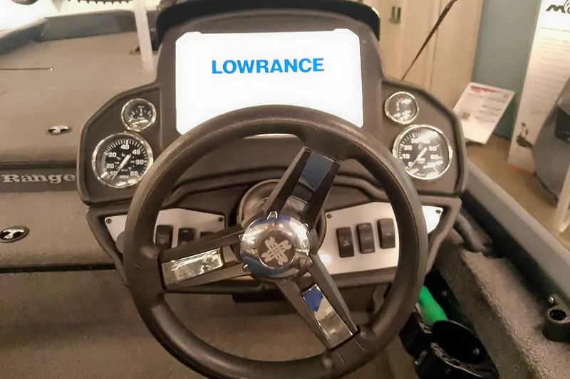 Slide: The Image of 2021 Ranger RT178 boat dashboard with Lowrance display and steering wheel. - 27