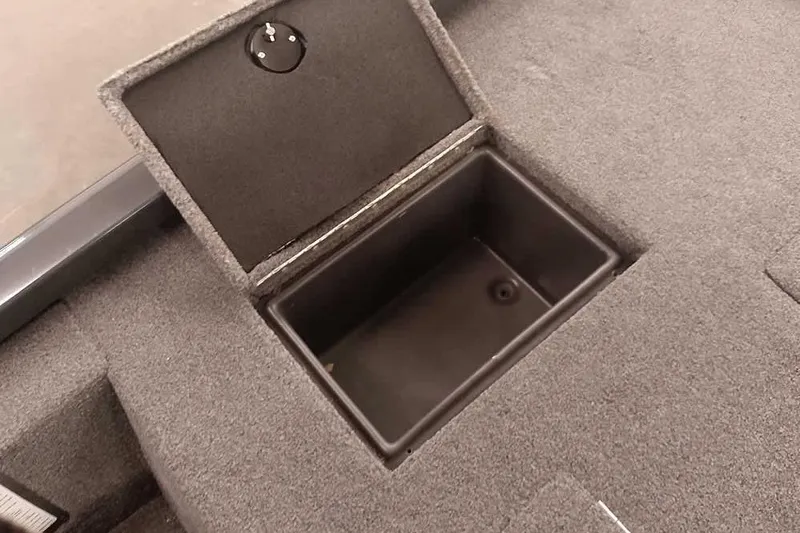 Slide: The Image of Open storage compartment in 2021 Ranger RT178 boat, featuring carpeted interior. - 31