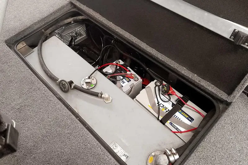 Slide: The Image of 2021 Ranger RT178 boat battery compartment with wiring and components. - 32