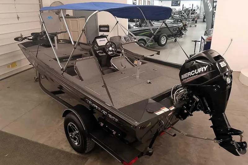 Slide: The Image of 2021 Ranger RT178 boat with Mercury engine and blue canopy in showroom. - 35