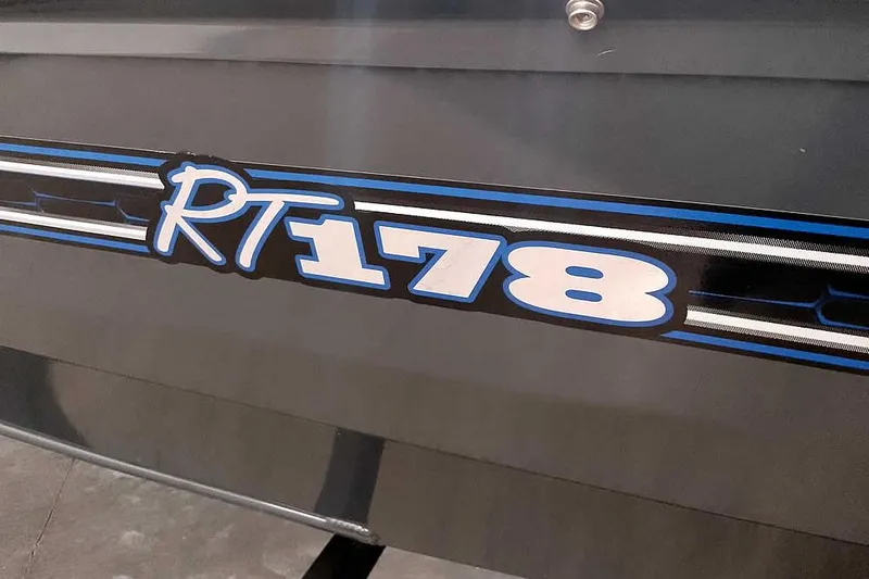 Slide: The Image of Close-up of 2021 Ranger RT178 model logo with blue and white design. - 5