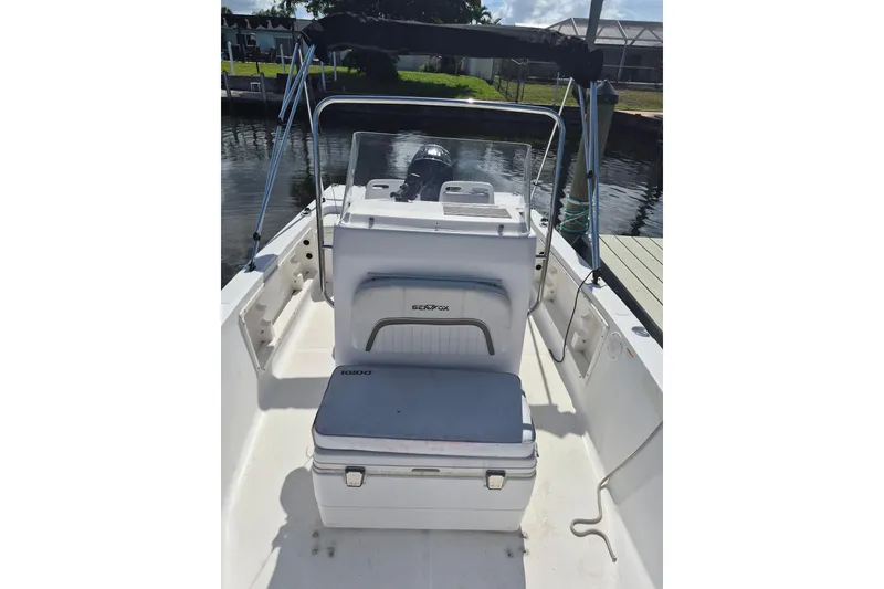 Slide: The Image of 2006 Sea Fox 197 Center Console boat interior with seating and console view. - 4