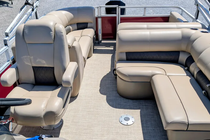 Slide: The Image of Luxurious seating on a 2020 Sun Tracker pontoon boat with beige upholstery and spacious layout. - 5