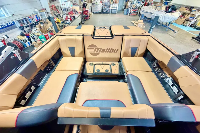 Slide: The Image of Interior of 2023 Malibu Wakesetter 23 LSV boat with tan and black seating. - 16