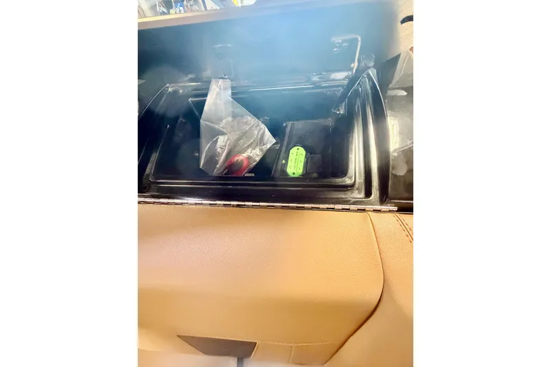 Slide: The Image of 2023 Malibu Wakesetter 23 LSV storage compartment with accessories inside. - 19