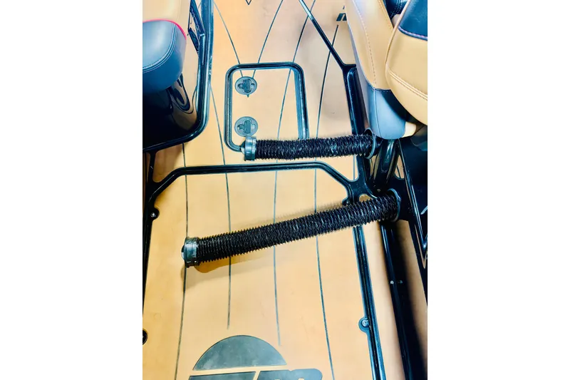 Slide: The Image of 2023 Malibu Wakesetter 23 LSV interior with footrests and tan flooring. - 20