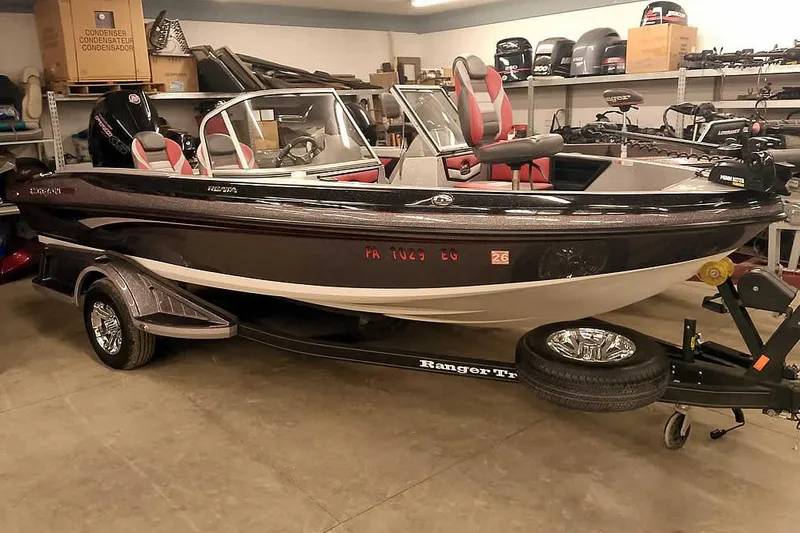 The Image of 2024 Ranger 1850MS Reata boat in showroom, featuring sleek design and modern equipment. - 1