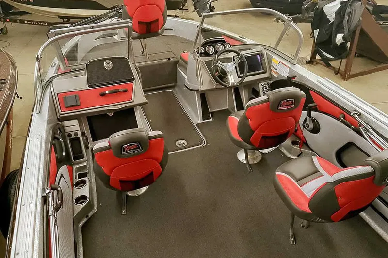 Slide: The Image of 2024 Ranger 1850MS Reata boat interior with red and gray seating, steering console, and storage compartments. - 11