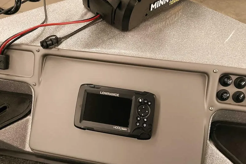 Slide: The Image of 2024 Ranger 1850MS Reata dashboard featuring Lowrance Hook fish finder and Minn Kota trolling motor. - 19