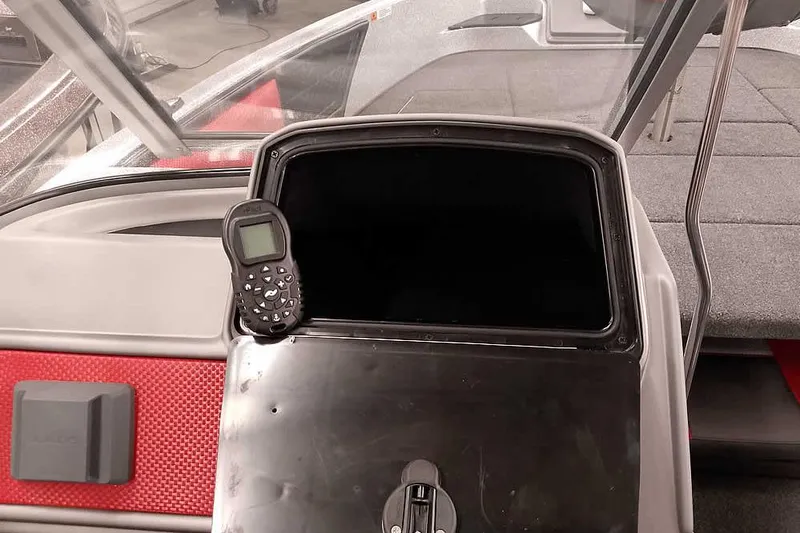 Slide: The Image of 2024 Ranger 1850MS Reata boat interior with control panel and seating area. - 28