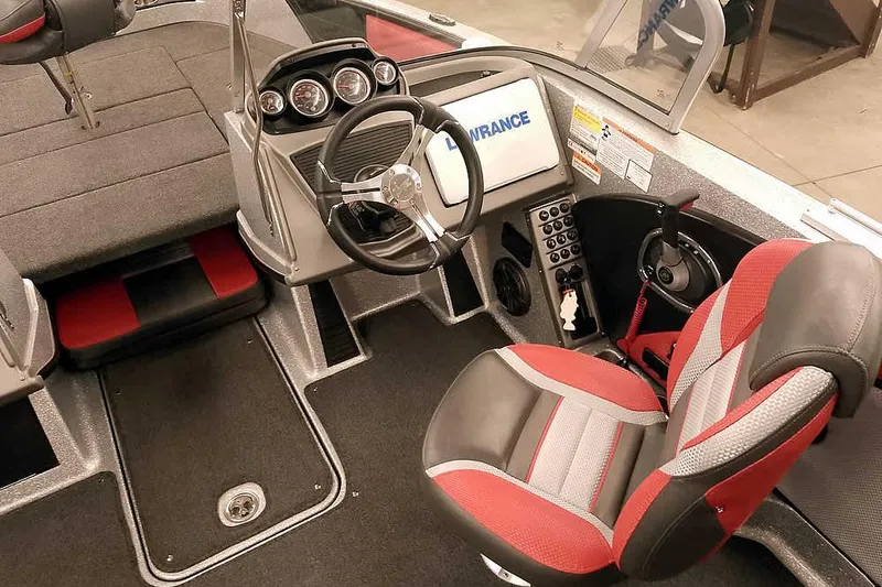 Slide: The Image of 2024 Ranger 1850MS Reata boat interior with steering wheel and red-gray seating. - 30