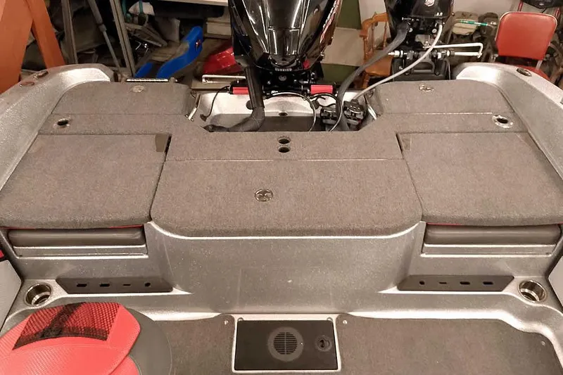 Slide: The Image of 2024 Ranger 1850MS Reata boat interior with motor and seating area. - 35