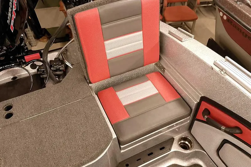 Slide: The Image of 2024 Ranger 1850MS Reata boat seat with red and gray upholstery, showcasing modern design. - 36