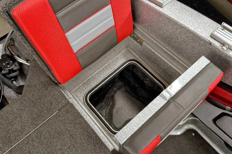 Slide: The Image of 2024 Ranger 1850MS Reata boat seat with storage compartment, featuring red and gray upholstery. - 37