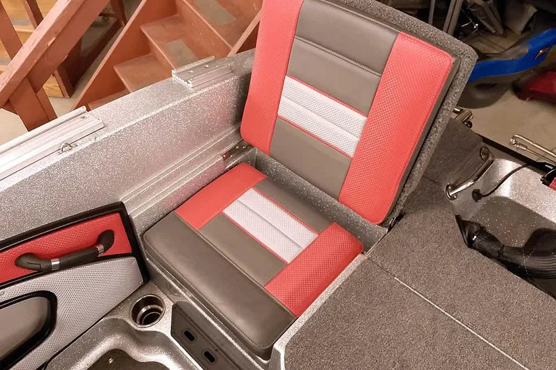 Slide: The Image of 2024 Ranger 1850MS Reata boat seat with red and gray upholstery. - 38
