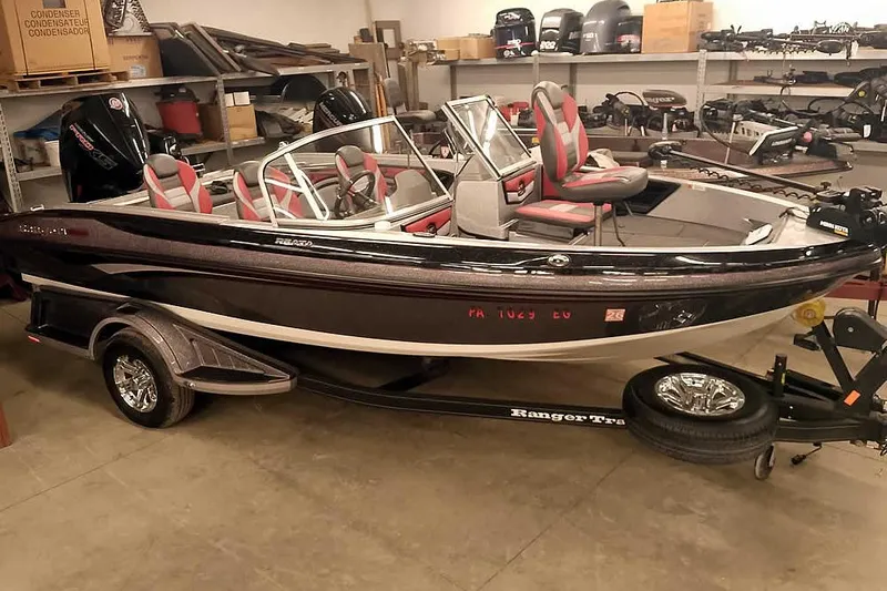 Slide: The Image of 2024 Ranger 1850MS Reata boat in showroom, featuring sleek design and modern seating. - 43