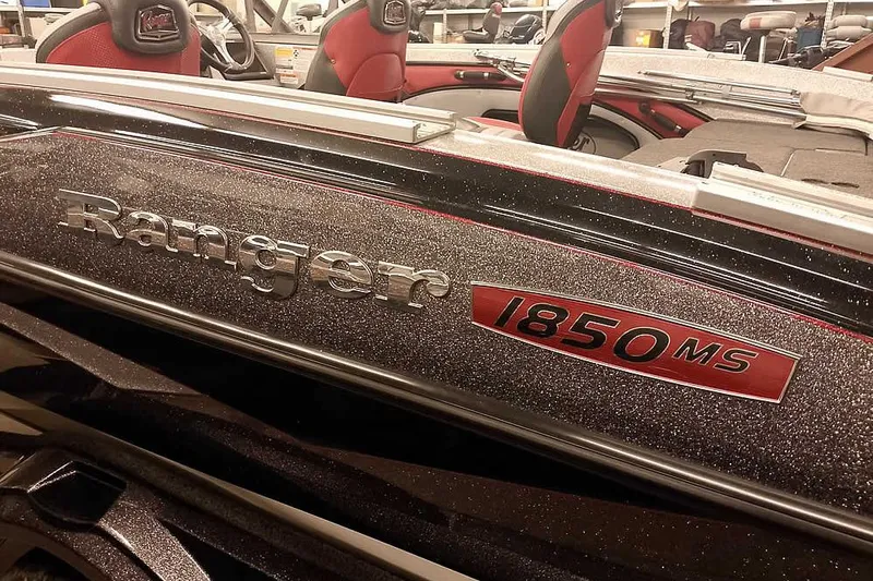 Slide: The Image of 2024 Ranger 1850MS Reata boat with sparkling finish and red interior accents. - 5