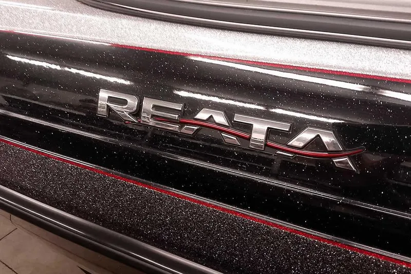 Slide: The Image of 2024 Ranger 1850MS Reata boat logo with metallic finish and red accents. - 6