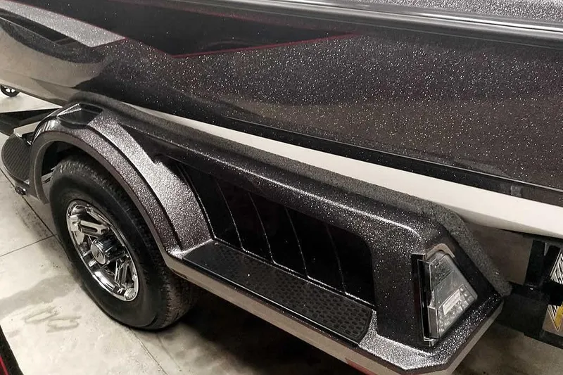 Slide: The Image of 2024 Ranger 1850MS Reata boat trailer with sleek, metallic finish and chrome wheels. - 8