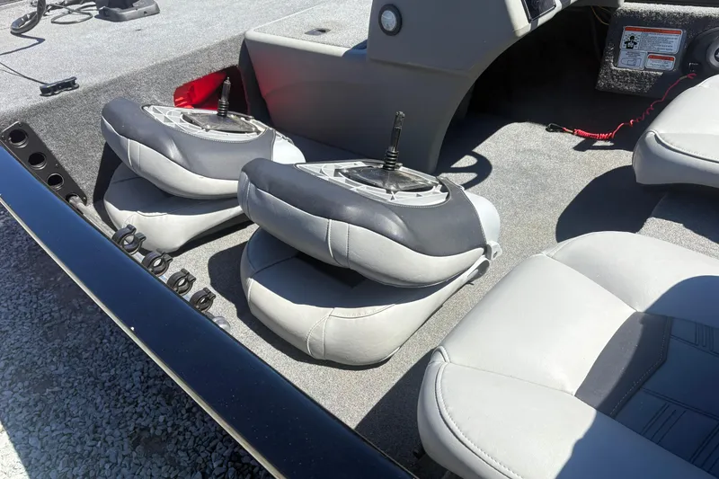 Slide: The Image of 2018 Tracker Pro 160 boat interior with folded seats and carpeted flooring. - 5