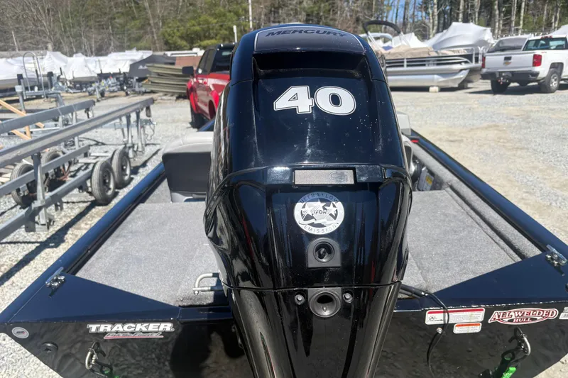 Slide: The Image of 2018 Tracker Pro 160 boat with Mercury 40 engine, parked outdoors. - 6