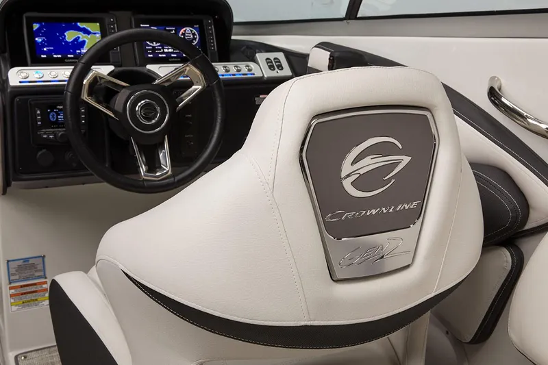 Slide: The Image of Manufacturer Provided Image: 2025 Crownline 278 SS boat interior with steering wheel and branded seat. - 6